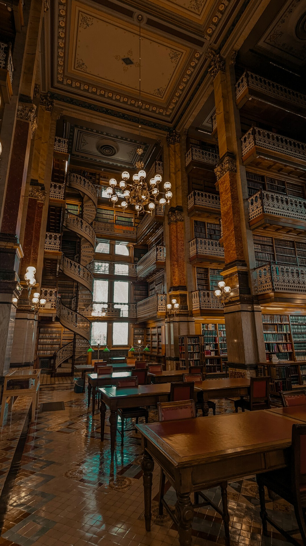 Quiet historic library reading room with tall bookshelves
